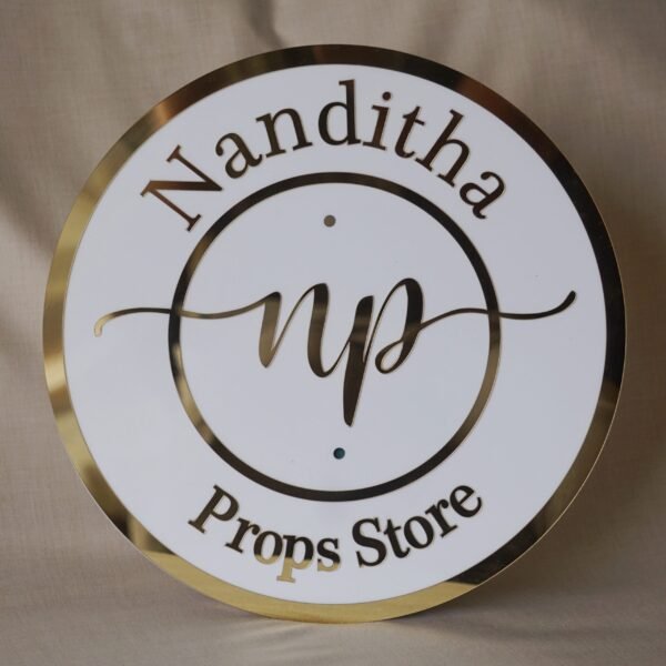 DSC06115 acrylic signboard for store in white and golden color with store logo in circular shape