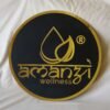 matte black acrylic signboard with 3d embossed letter and logo the shape of this signboard is round