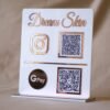 qr code scan stand in white and pink with payment and social media option