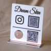 qr code scan stand in white and pink with payment and social media option