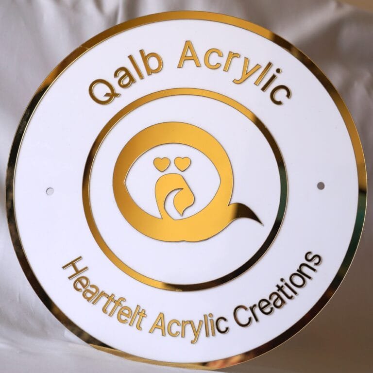 qalb acrylic logo and tagline on round acrylic signboard made using gold and white acrylic sheet