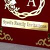 Nikah Invitation Booklet Made using red velvet and golden acrylic, the size of the product is 14 by 12 inches.