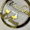 Golden round wall hanging with couple's name. Acrylic and MDF.