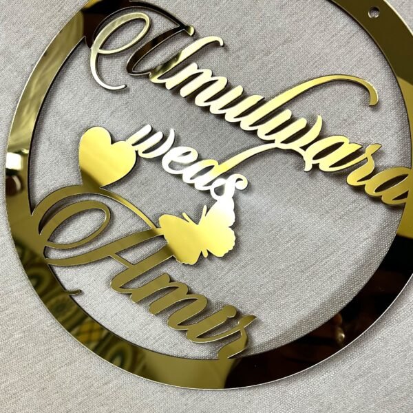 IMG_1278 Golden round wall hanging with couple's name. Acrylic and MDF.