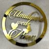 Golden round wall hanging with couple's name. Acrylic and MDF.
