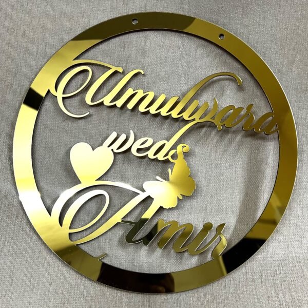 IMG_1283 Golden round wall hanging with couple's name. Acrylic and MDF.