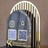 Acrylic QR stand with a golden grilled background for a premium look, this QR code stand is used for connecting with clients on social media and receiving payments seamlessly.