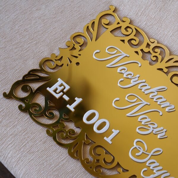 The acrylic nameplate for the home in a Victorian-style border is made using acrylic and MDF for durability, and a golden acrylic sheet is used for royal looks. This nameplate will be a perfect statement piece for the home entrance.