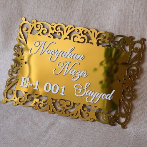 The acrylic nameplate for the home in a Victorian-style border is made using acrylic and MDF for durability, and a golden acrylic sheet is used for royal looks. This nameplate will be a perfect statement piece for the home entrance.