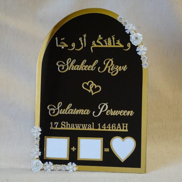 DSC07622 Black and gold acrylic Nikah thumb board with customizable names, ideal for Muslim wedding ceremonies.