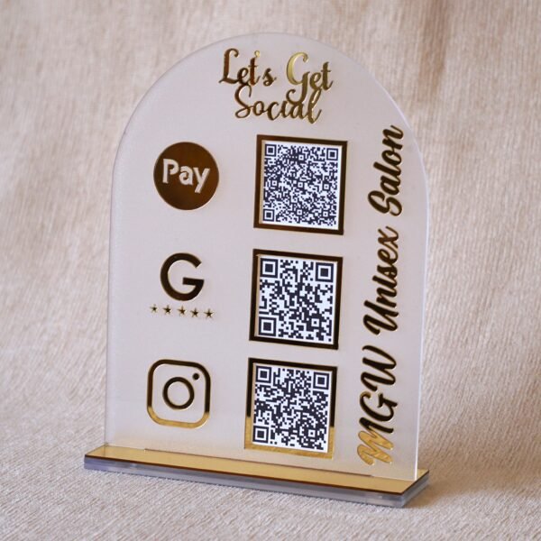 1740235489341 A customizable QR code stand made using imported acrylic and golden sheets is perfect for business desks and exhibitions. The QR codes and brand name can be customized. The stand is removable, and the size of the product is 5 by 7 inches.