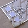 Transparent & silver acrylic personalized wedding thumbprint frame with floral corner embellishments, embossed bride and groom names and date, plus dedicated thumbprint spaces.
