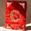A red fur–clad nikah nama booklet with an acrylic cover and MDF backing, opened to blank pages for the bride’s and groom’s thumbprints and signatures as a lasting wedding keepsake