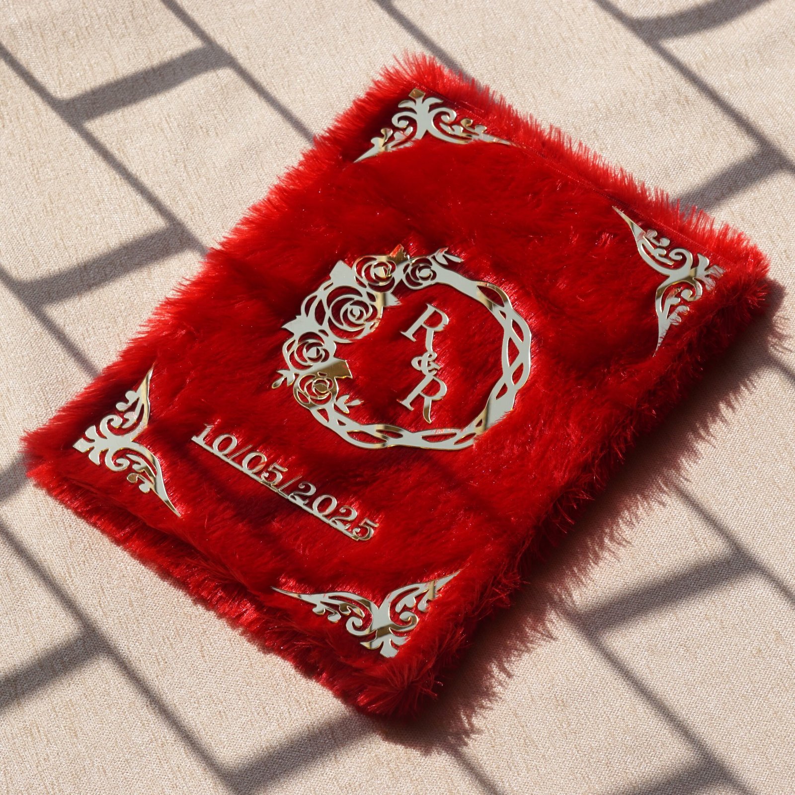 A red fur–clad nikah nama booklet with an acrylic cover and MDF backing, opened to blank pages for the bride’s and groom’s thumbprints and signatures as a lasting wedding keepsake